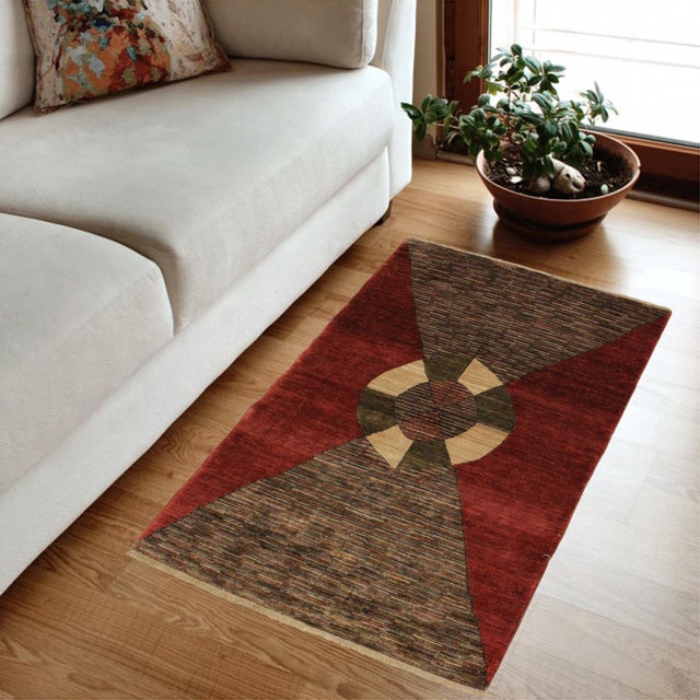 Transform your home's interior with a stunning hand-knotted Gabbeh rug. These rugs are meticulously crafted with bold...