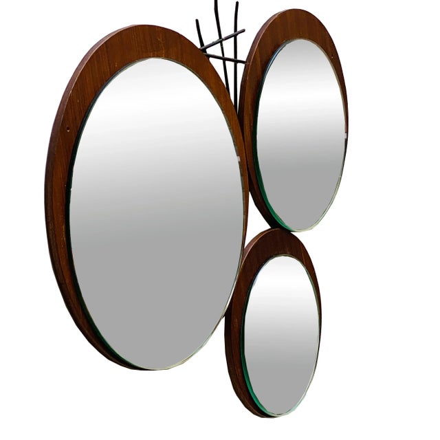 Unique wall mirror with three panes of glass mounted on a teak wood base and wrought iron insert, Italian production 1960....