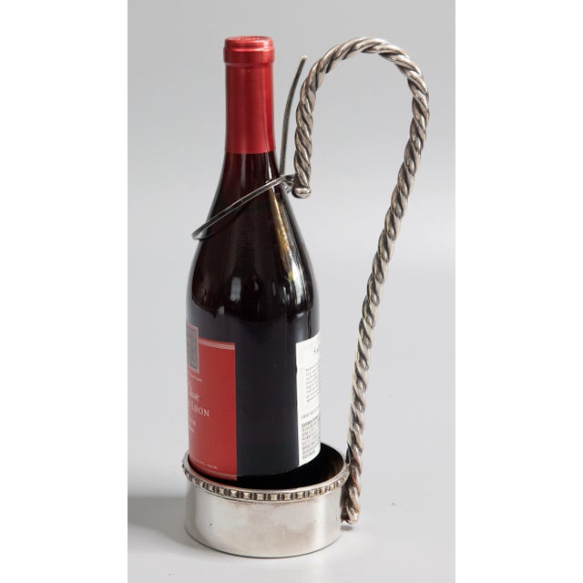 A fine vintage Italian silverplated wine bottle holder, caddy, or server with a lovely aged patina. Marked "Made In Italy"...