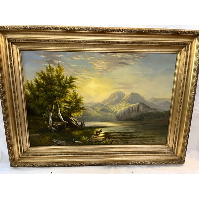 A large oil on canvas painting of a Western landscape of a mountainous n range in the background with a moose in the front...