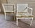 Introducing this exquisite pair of Vintage Faux Bamboo and Cane Backed Armed Side Chairs in Off White with Upholstered...