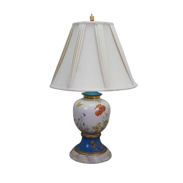 This stunning pair of antique table lamps features matching structures with asymmetrical hand-painted botanical artwork on...