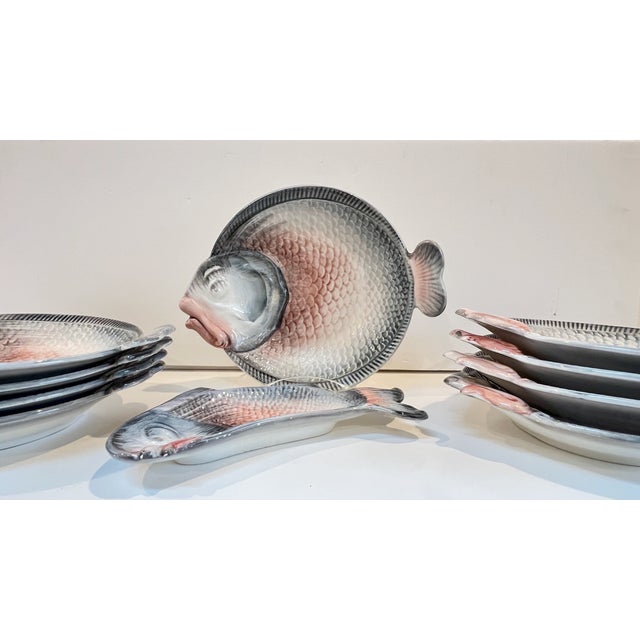 Set of 8 high quality, Italian ceramic figural fish plates/bowls and one small serving tray that measures 10.25"l x 4.5"w...