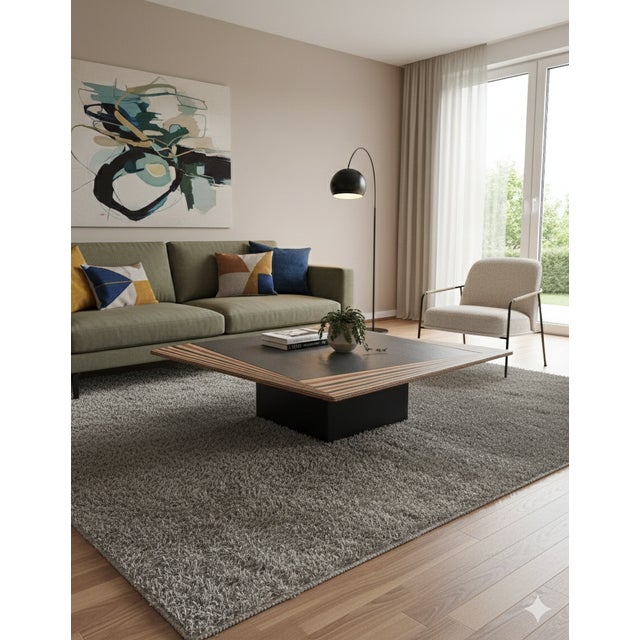 This piece of furniture is often attributed to or associated with the style of Italian designers Afra and Tobia Scarpa....