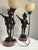 Elegant pair of mid-20th-century Italian Venetian style figural table lamps, heavily drawing inspiration from classical...