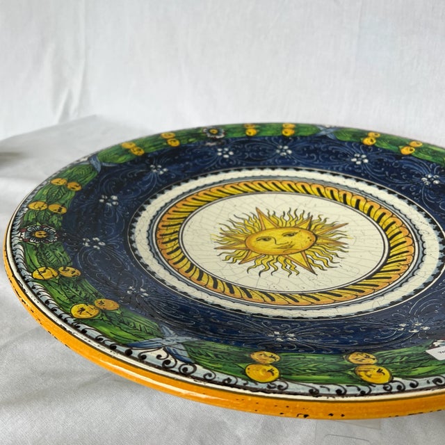 Hand Painted Blue and Green Ceramic Round Sun Center Wall Plate. Created in Italy. Made in the 1990s.