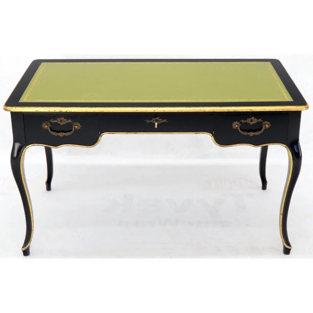 Black lacquer embossed green lather top French Provincial writing table or desk with three drawers by Baker. Stunning...