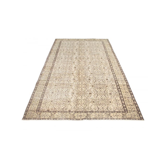 Decorative washed out handknotted vintage rug from Oushak region of Turkey. Approximately 50-60 years old. In very good...