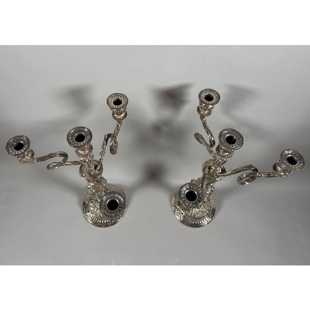 Pair of Rococo Candelabra in 950 Sterling Silver. In the 18th-century Louis XV style. The circular base with contoured...