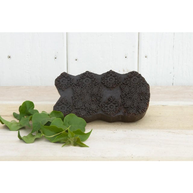A vintage wooden printing block from India, it is hand-chiseled by artisans and its used to hand print textiles. It...