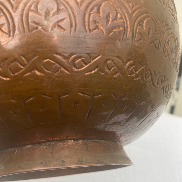 Bring a touch of Old World texture and history to your space with this stunning antique Middle Eastern copper bowl. Fully...