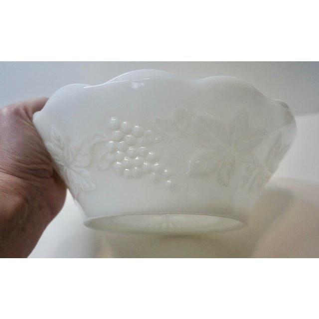 Elevate your tablescape, buffet, or vanity with this curated three-piece set of vintage milk glass in the iconic "Harvest...