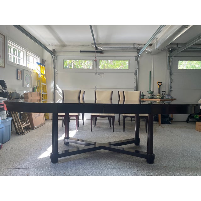 Stunning mahogany oval dining table and six art deco styled mahogany chairs designed by Barbara Barry for Baker Furniture....