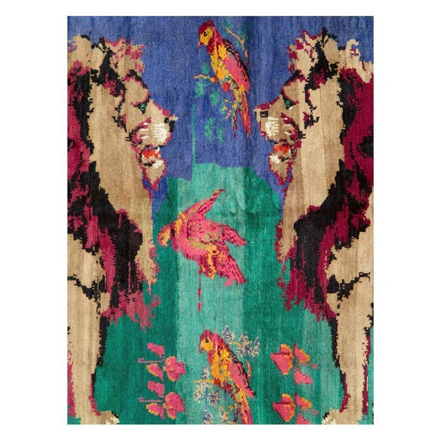 A vintage Caucasian Karabagh rug handmade during the mid-20th century with a pictorial design of 2 male lions facing off....