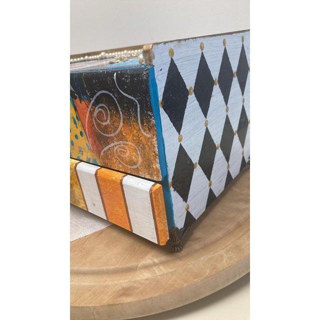 One of a kind, hand painted and embellished box. Two drawers. Measures 13” wide x 8” deep x 7” high. Beautiful woman with...