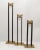 Set of three Nesting Mid-Century Modern black Enamel and Brass candle holders or candlesticks. The set is very old and we...