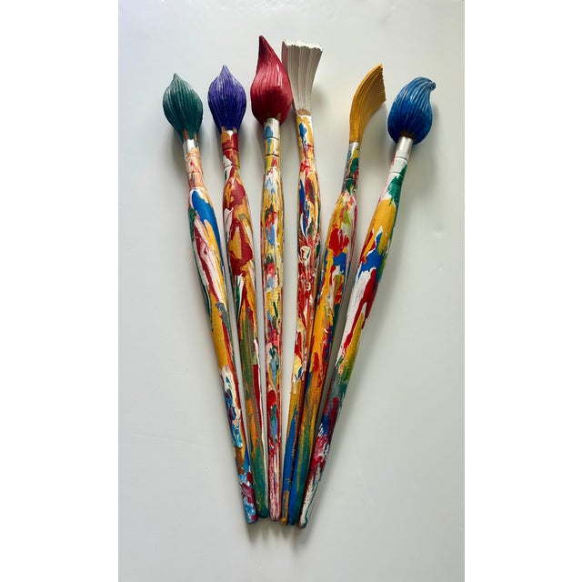 Six wooden paint brushes plus a vase / pot The largest brush is 26 1/4" tall The shortest brush is 24 1/2" The vase is 10"...