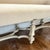 This sculptural bench is both baroque and modern suitable for most styles. Priced to allow for reupholstery. 62” x 20” x...