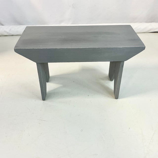 A classic piece of Americana Folk Art. This pine bench is from the 1950s and hand-crafted probably as a high school shop...
