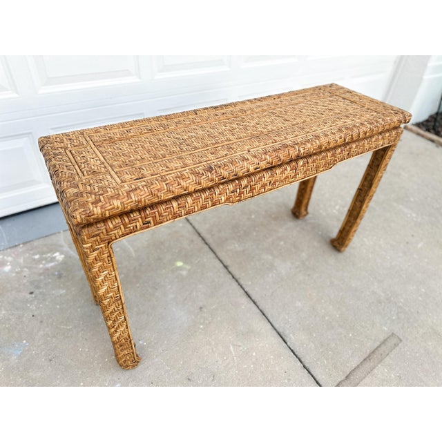 A shape with quiet confidence. This vintage rattan console features a tightly woven top, subtle waterfall edge, and...