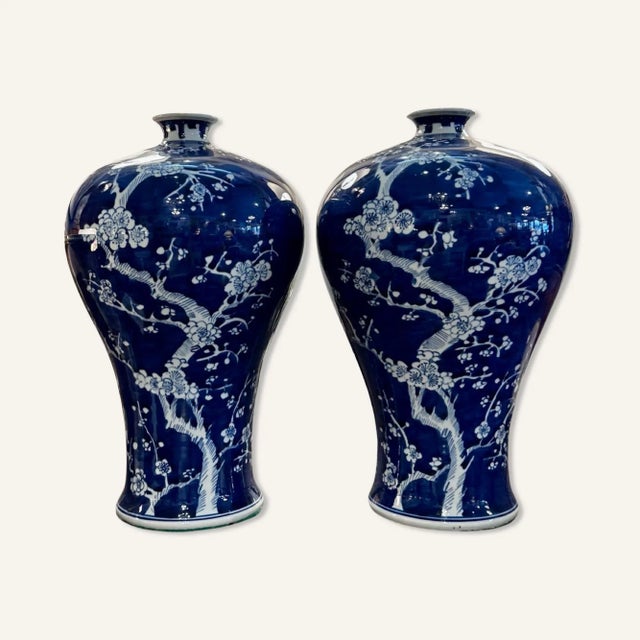 These 19th century blue and white Chinese export porcelain vases are decorated with the Hawthorne or prunus pattern on a...