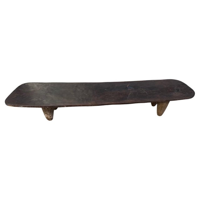 Rare antique coffee table hand carved by the Senufo tribes from a single block of wood, native to the west coast of...