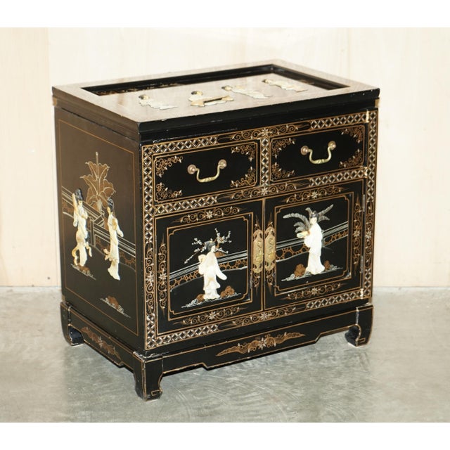 Lovely vintage Chinese side cabinet with native scenes of Geisha girls carved out of soapstone and decorated in the...
