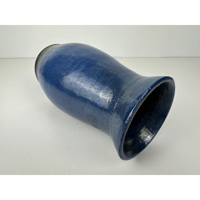Ceramic vase. Blue flamed glaze. Signed: Dédé. Belgian. The ceramic shows a ‘flaw’ on the collar. This occurred in the...