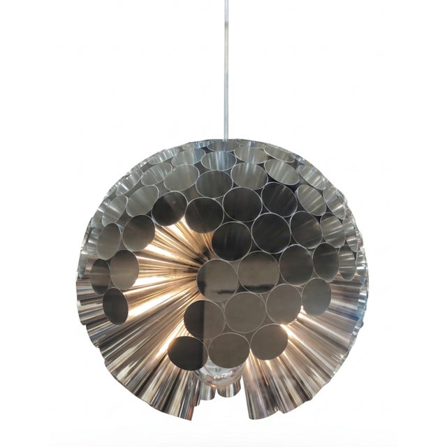 The Planet Gong suspension lamp is a visual tribute to the mythological universe of the progressive rock band Gong....