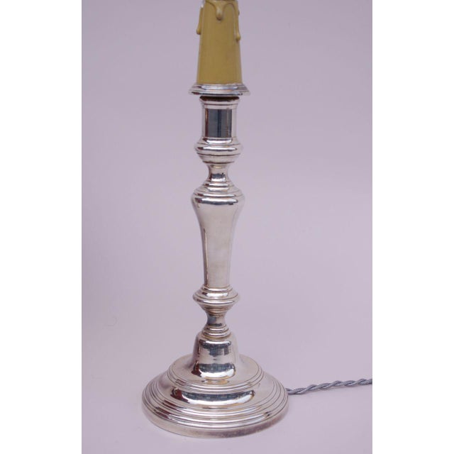 - Pair of silvered metal Louis XVI style candlesticks - Molded and slightly bulged shaft standing on a molded circular...