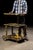 Vintage cast iron rolling industrial cart. This piece features three tiers of storage, with an adjustable-height top...