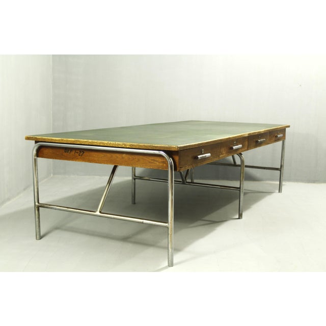 A unique writing desk from the 1930s; the desk is in its original condition with no alterations or repairs. The screws...