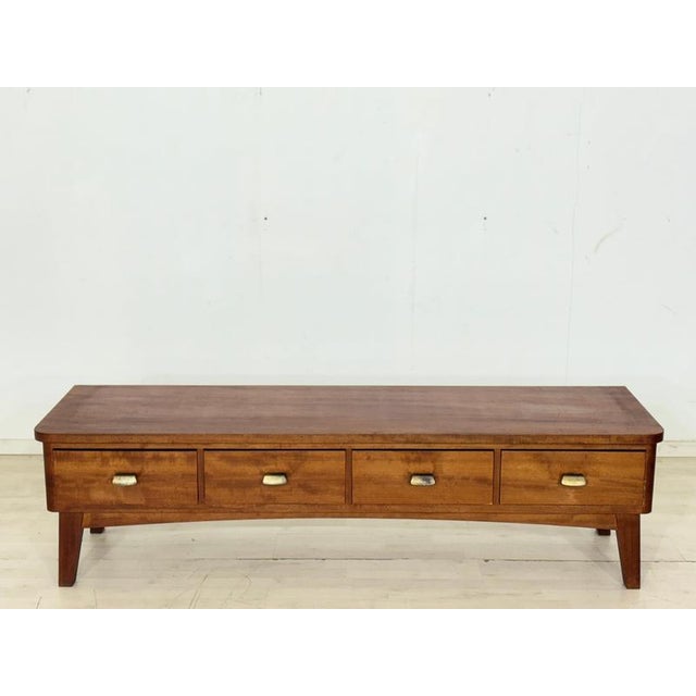 An elegant mid-century lowboard from the 1960s. This piece of furniture impresses with its clean, horizontal lines, gently...