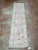 Turkish Oushak pink runner, hand-knotted in Afghanistan from 100% wool. Measuring 2’9” x 11’8”, the rug features a soft...