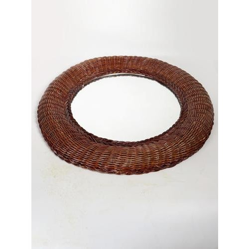 A typical 1970s wicker mirror, made in France. This decorative mirror charms with its natural and warm weave, emblematic...