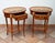 A pair of antique side tables made of fine exotic woods, dating from the early 20th century. The tops are oval in shape...
