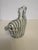 This heavy murano hand blown glass sculpture is just adorable in it's own right. The height of the zebra is 5", with the...