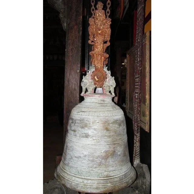 A huge antique bronze bell with iron top. This large bell has all the original patination from many years of use and...