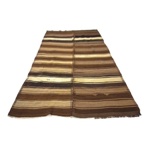 Handwoven vintage brown kilim rug from Kars region of Turkey. Approximately 50-60 years old. In very good condition