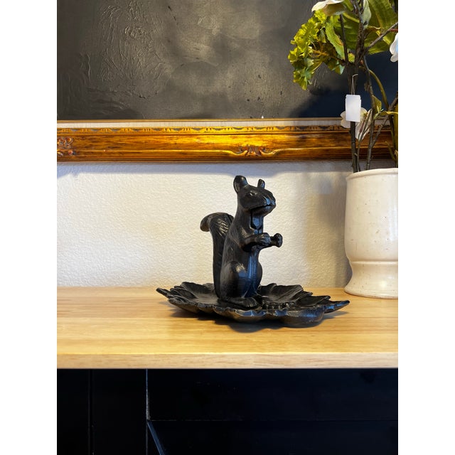 Celebrate the beauty of nature-inspired design with this distinctive vintage cast aluminum squirrel nutcracker and...
