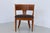Charming antique armchair in solid Nordic oak with inlaid marquetry in the backrest and small carved detail son the legs....