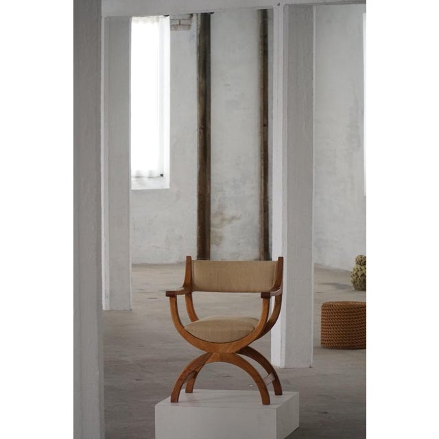 A fine and elegant armchair in solid oak, designed by henning kjærnulf for eg kvalitetsmøbel, denmark, 1960s. Model...