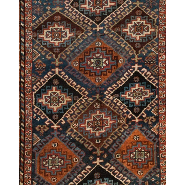 This lovely antique Persian Kurdish green carpet measures: 4.11 x 9.6 ft. and is from 1920s-1930s.