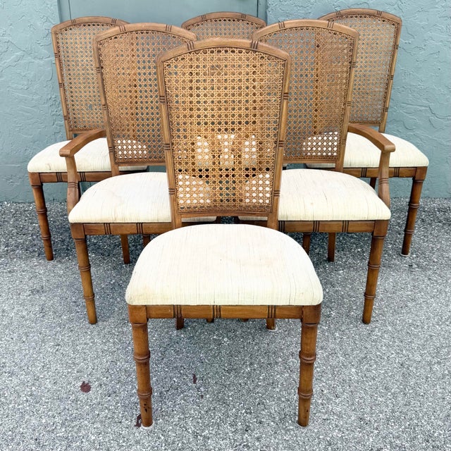 Vintage set of six dining chairs by Chaircraft featuring warm faux bamboo frames and beautifully woven cane backs. The set...