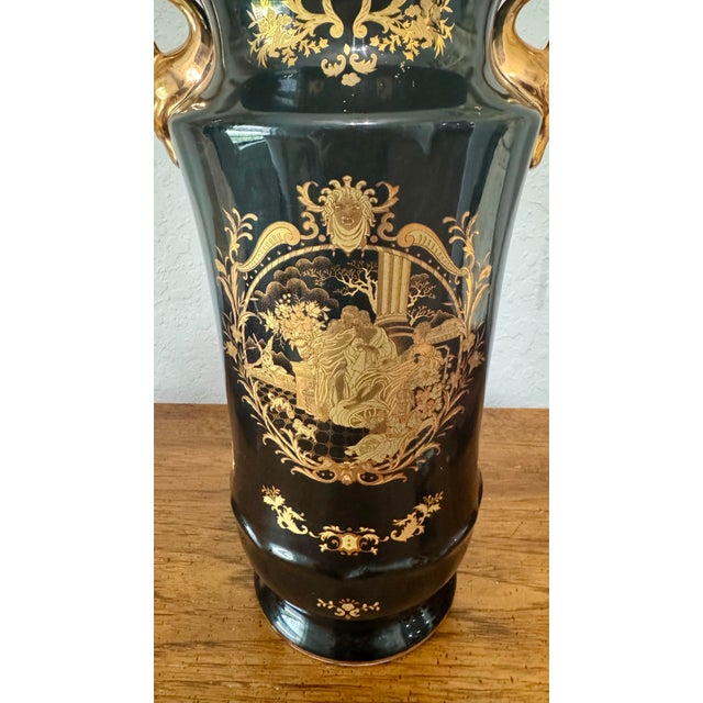 Add a touch of Neoclassical and Hollywood Regency elegance to your home decor with this striking black ceramic urn vase....