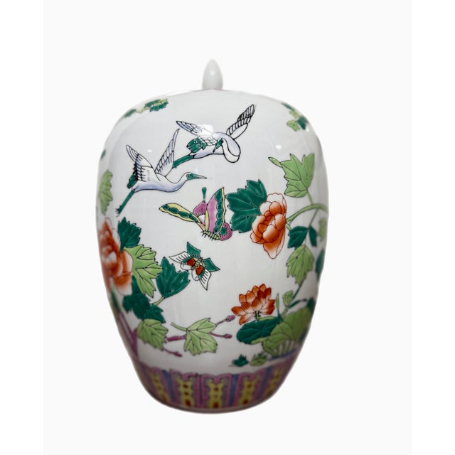 Beautiful and brightly colored ginger jar. Wonderful scenes of cranes, roosters, peonies and garden life. Hand painted....