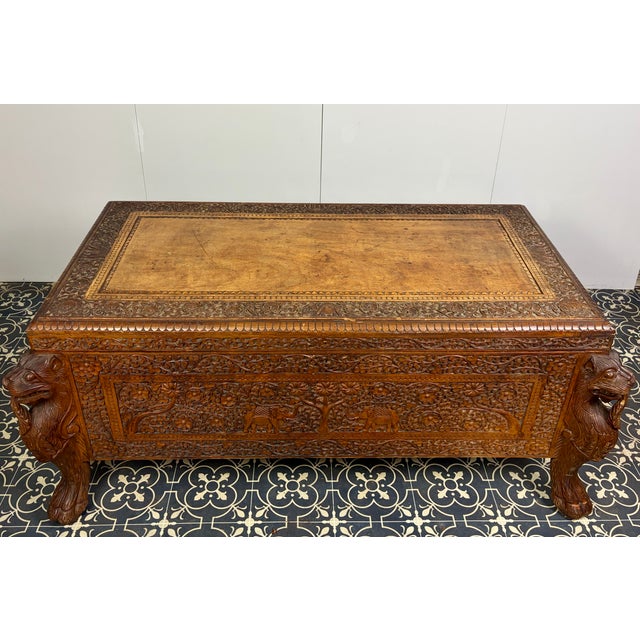 Stunning early 20th-century hand-carved Indian Exotic Hardwood Dowry Storage Trunk. Add a touch of timeless global...