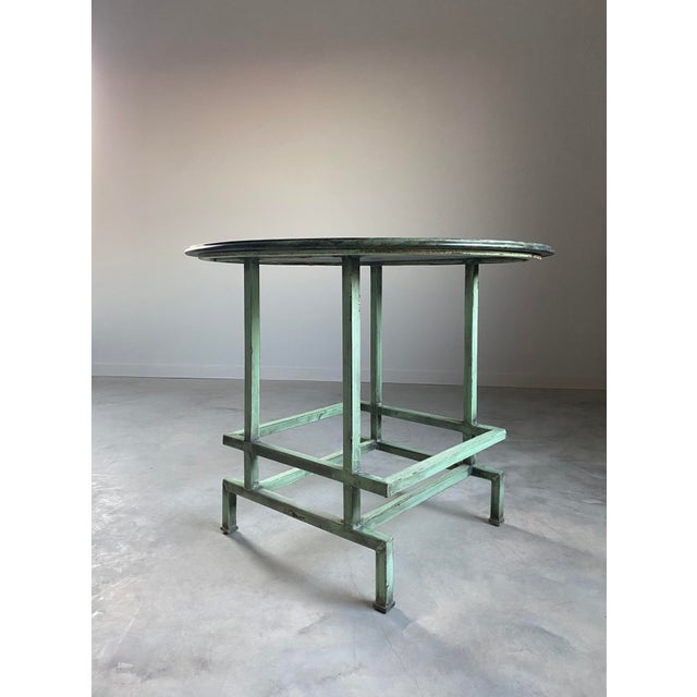 Marble and Welded Steel Center Table A teal-painted welded steel base in a French Industrial Modernist style, topped with...