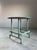Marble and Welded Steel Center Table A teal-painted welded steel base in a French Industrial Modernist style, topped with...