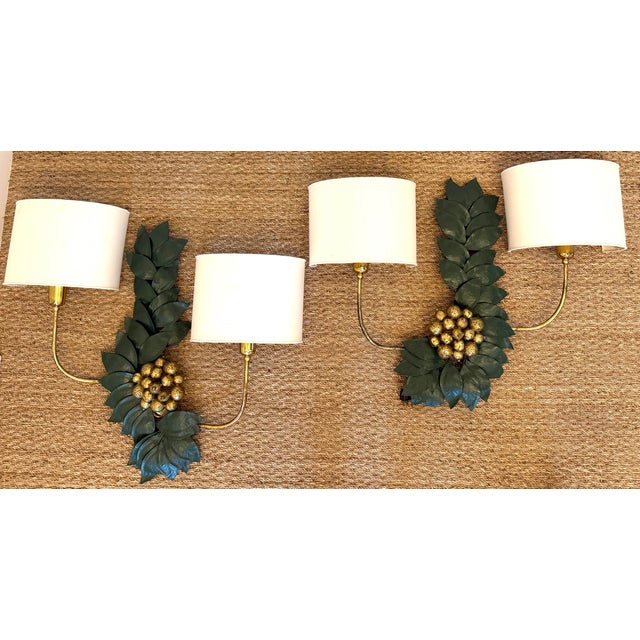 Bronze and Brass wall sculptures, resembling grape leaves. Impressive size and weight. Each sconce has two light sources...